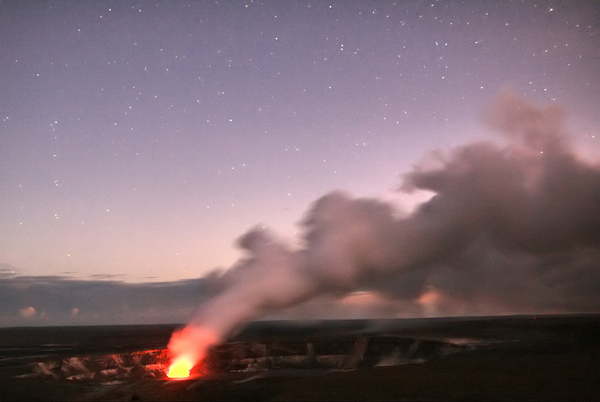 Halemaumau Crater glows under the clear sky